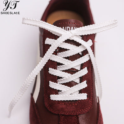 White lace-woven shoelaces
